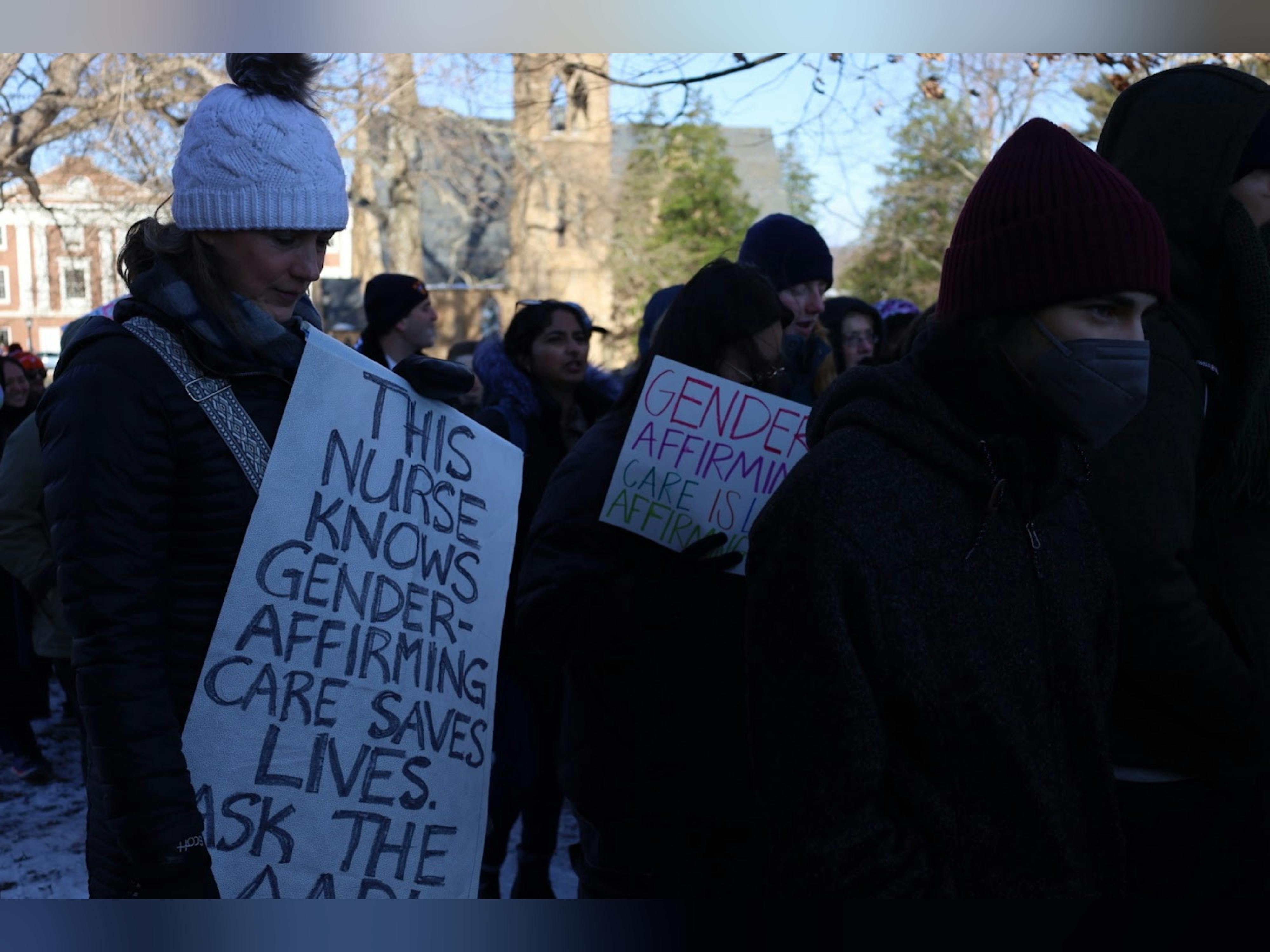 Nurses and others rally at the University of Virginia on behalf of gender-affirming care.